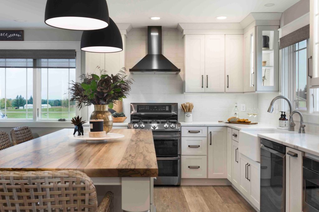 Elegant Contrast: Black Stainless Steel Appliances with White Cabinets